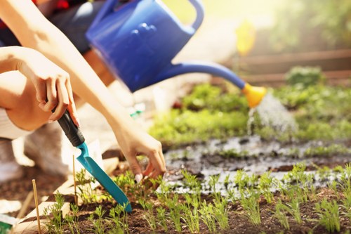 Landscaped garden design in Yiewsley with lawn and paving
