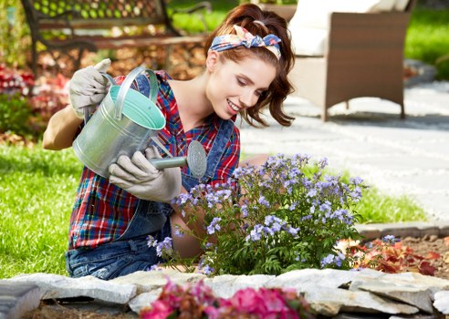 Team member assessing a garden service issue carefully